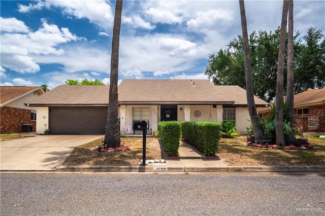 6800 N 15th Ln, Mcallen, TX 78504 - ranch-style house with brick siding, a garage, and concrete driveway