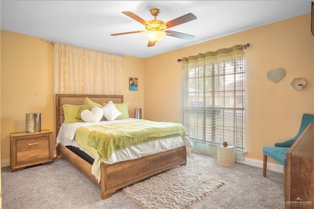 6800 N 15th Ln, Mcallen, TX 78504 - carpeted bedroom with baseboards and a ceiling fan