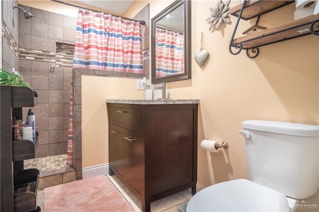 6800 N 15th Ln, Mcallen, TX 78504 - bathroom with tiled shower, vanity, and tile patterned floors
