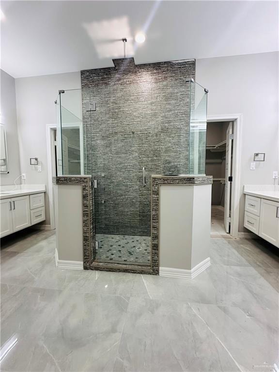 bathroom with walk in shower and vanity