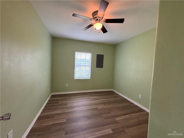 512 S 24th St, Donna, TX 78537 - spare room featuring electric panel, ceiling fan, dark wood finished floors, and baseboards