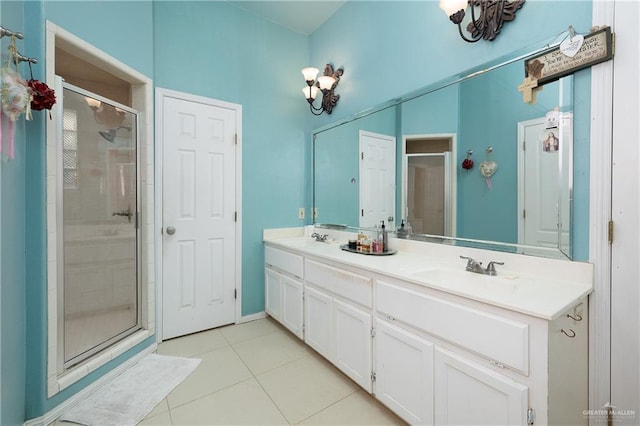 912 Bentsen Rd, Mcallen, TX 78501 - bathroom with a stall shower, tile patterned flooring, and double vanity