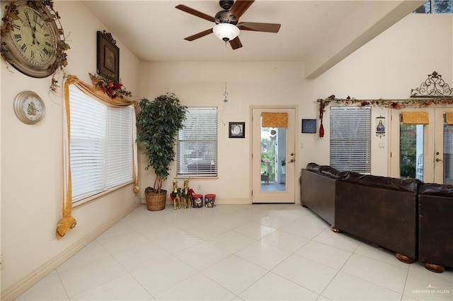 912 Bentsen Rd, Mcallen, TX 78501 - living room with healthy amount of natural light, a ceiling fan, baseboards, and light tile patterned floors