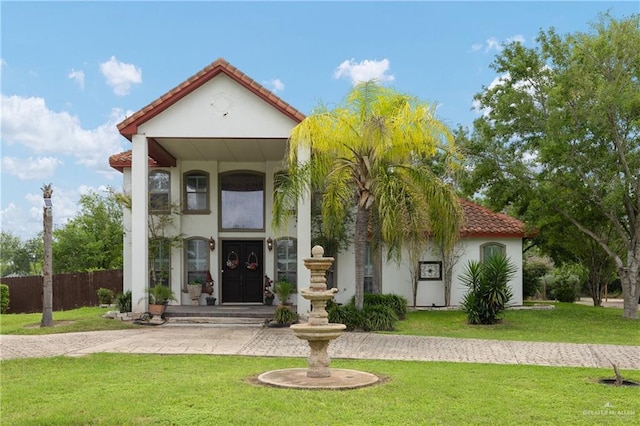 912 Bentsen Rd, Mcallen, TX 78501 - mediterranean / spanish-style home featuring a tiled roof and stucco siding
