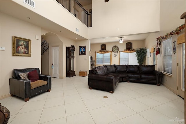 912 Bentsen Rd, Mcallen, TX 78501 - living room with a high ceiling, light tile patterned floors, and baseboards