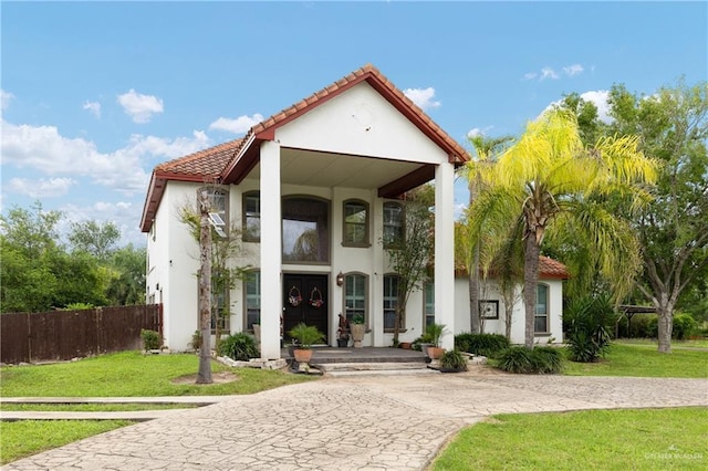 912 Bentsen Rd, Mcallen, TX 78501 - entrance to property featuring a tiled roof, curved driveway, and stucco siding