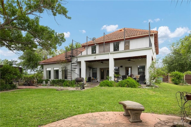 912 Bentsen Rd, Mcallen, TX 78501 - back of property with a ceiling fan, a patio, a tiled roof, and stucco siding
