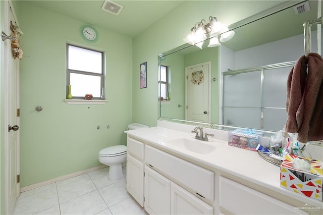 912 Bentsen Rd, Mcallen, TX 78501 - bathroom featuring healthy amount of natural light, vanity, a shower stall, and toilet