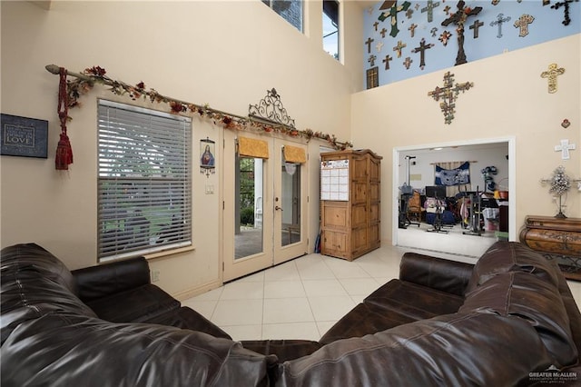 912 Bentsen Rd, Mcallen, TX 78501 - living room featuring french doors, tile patterned floors, and a towering ceiling