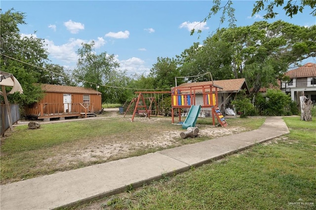 912 Bentsen Rd, Mcallen, TX 78501 - view of jungle gym featuring a yard and a wooden deck