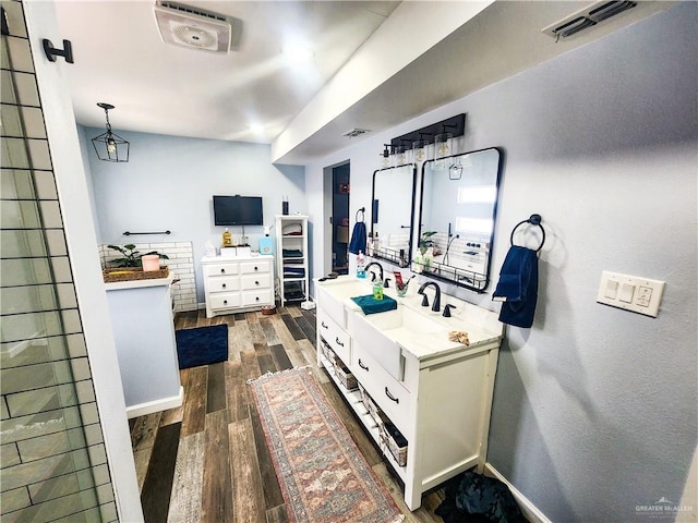 1405 S Brier St, Alton, TX 78573 - bathroom with double vanity, wood finished floors, and a walk in closet