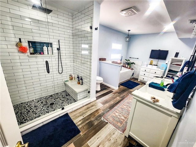 1405 S Brier St, Alton, TX 78573 - full bath featuring wood-type flooring, vanity, a shower stall, and a bath