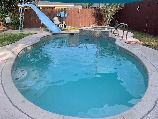 1405 S Brier St, Alton, TX 78573 - view of pool featuring a fenced backyard, an in-ground hot tub, a water slide, and a patio