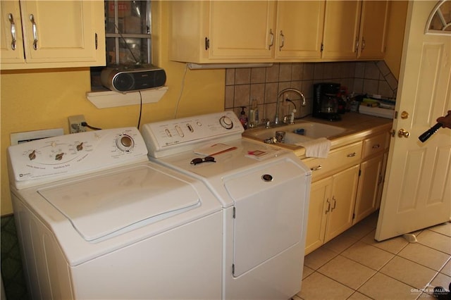 1405 S Brier St, Alton, TX 78573 - laundry room featuring washer and clothes dryer, light tile patterned floors, and cabinet space