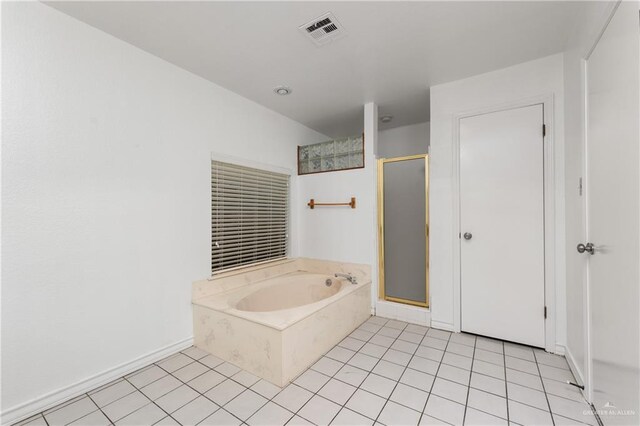 bathroom featuring tile patterned floors and separate shower and tub