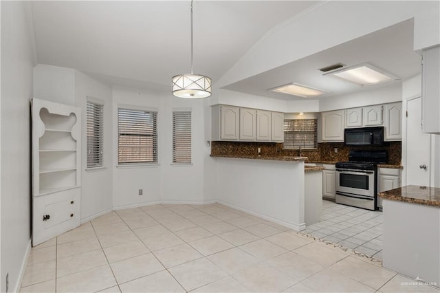 kitchen with tasteful backsplash, decorative light fixtures, stainless steel range with gas stovetop, kitchen peninsula, and white cabinets