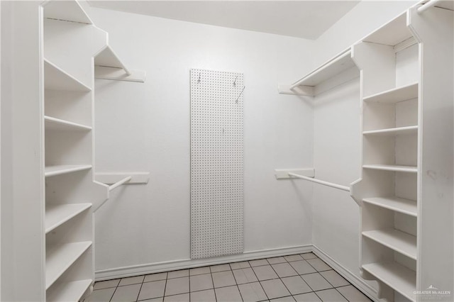 walk in closet featuring light tile patterned floors