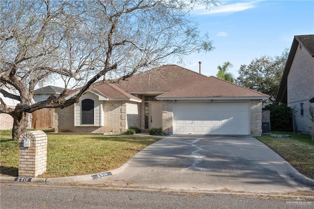 ranch-style house with a garage and a front yard