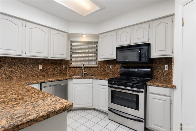 kitchen featuring white cabinetry, appliances with stainless steel finishes, sink, and tasteful backsplash