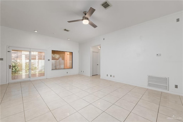 tiled spare room with ceiling fan