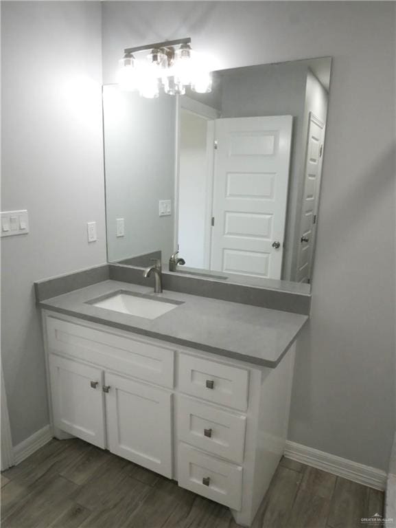 bathroom featuring vanity and wood-type flooring