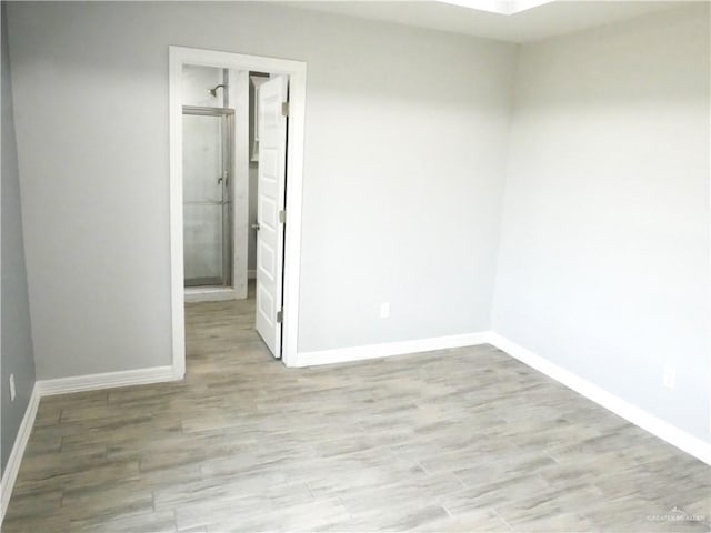 spare room with light wood-type flooring