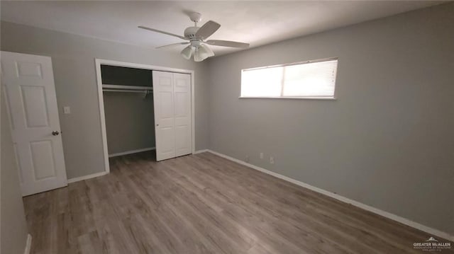 1600 Bridge Ave Unit 207, Weslaco, TX 78596 - unfurnished bedroom featuring wood finished floors, baseboards, a closet, and ceiling fan