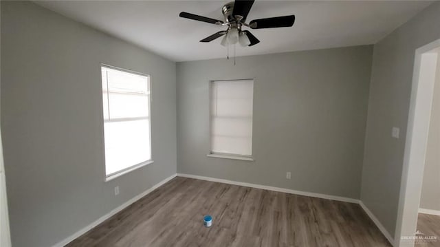 1600 Bridge Ave Unit 207, Weslaco, TX 78596 - empty room featuring wood finished floors, healthy amount of natural light, and a ceiling fan
