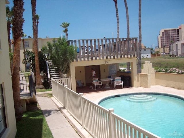 view of swimming pool featuring a patio