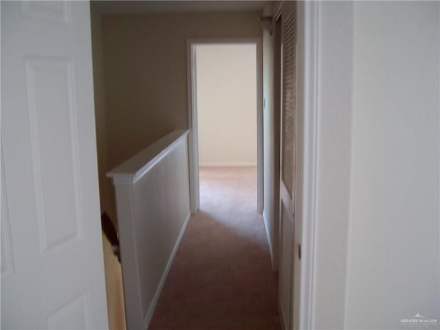 hallway featuring carpet flooring