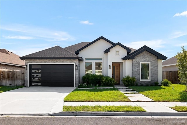 view of front facade with a front lawn and a garage