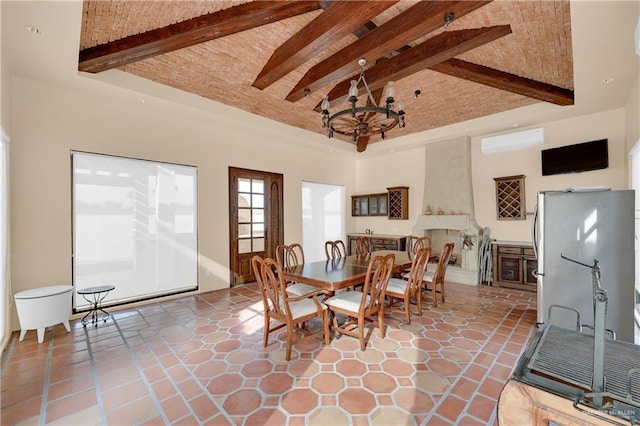 dining room with a wall mounted AC, brick ceiling, beamed ceiling, a towering ceiling, and an inviting chandelier