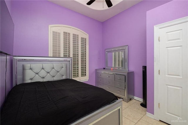 tiled bedroom with ceiling fan