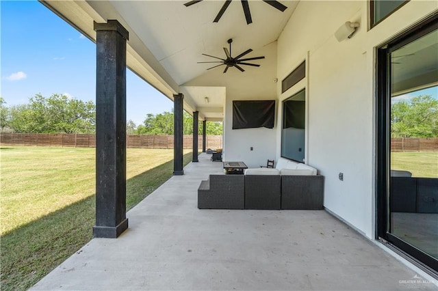view of patio featuring outdoor lounge area, fence, and ceiling fan