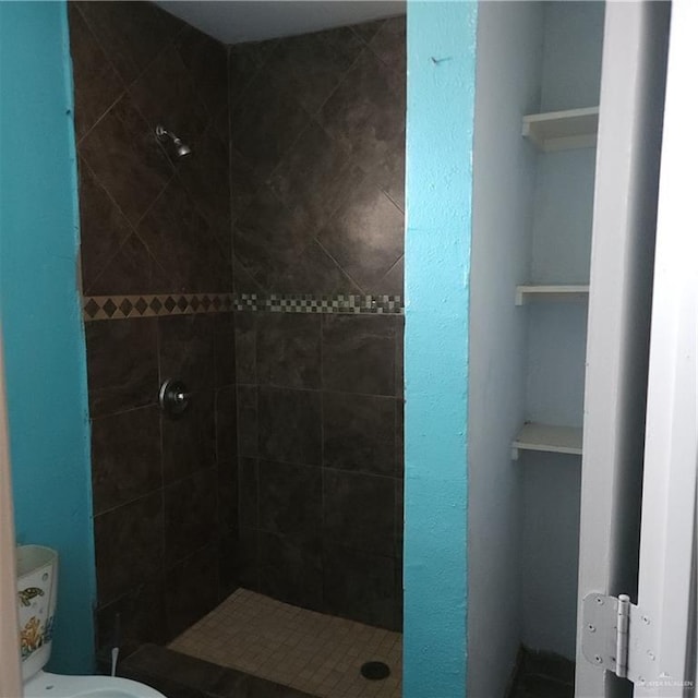 bathroom with a tile shower