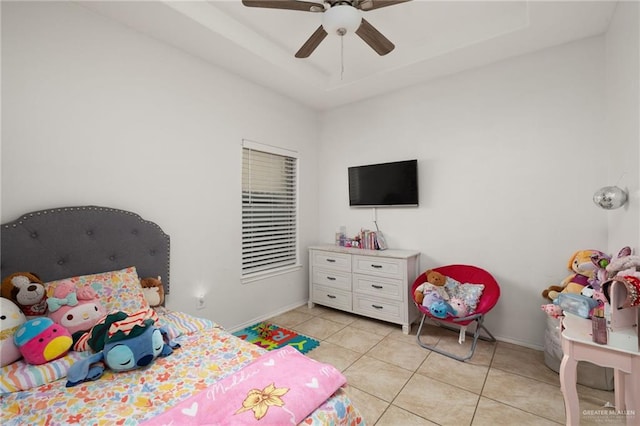 3517 Prestwick St, Edinburg, TX 78542 - bedroom featuring light tile patterned floors, a ceiling fan, and a raised ceiling