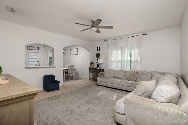 3517 Prestwick St, Edinburg, TX 78542 - tiled living area with arched walkways and ceiling fan