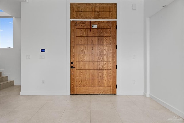 unfurnished room featuring light tile patterned floors