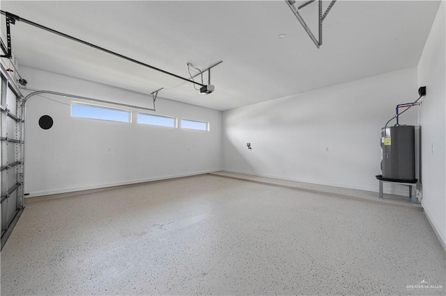 garage featuring a garage door opener and electric water heater