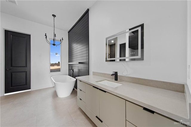 bathroom featuring a tub to relax in and vanity