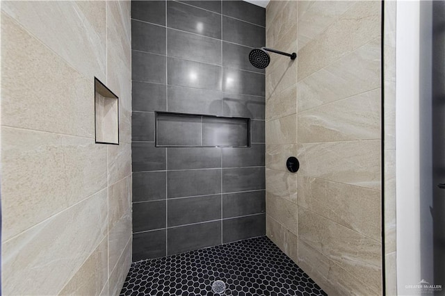 bathroom with tiled shower