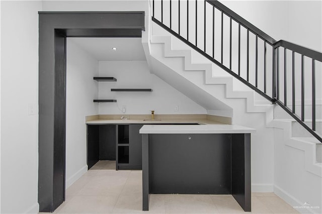 bar featuring light tile patterned floors