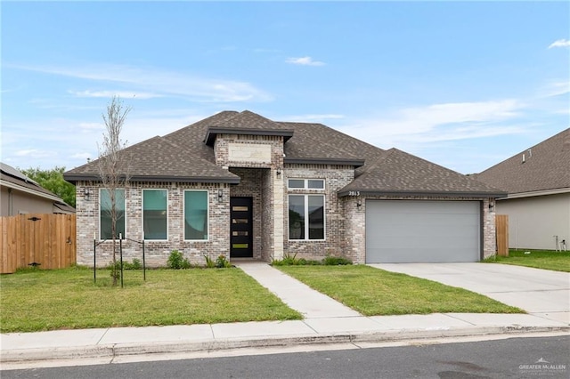 prairie-style house with a garage and a front lawn