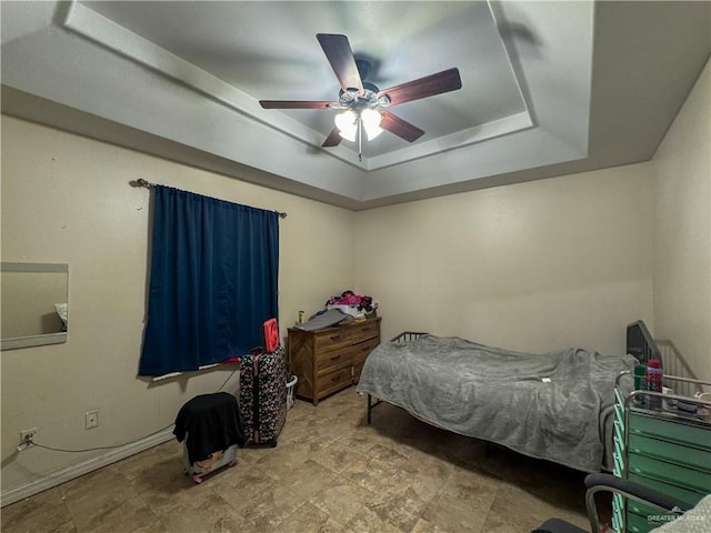 13307 Ash Ave, Edinburg, TX 78542 - bedroom with a raised ceiling, ceiling fan, and stone finish flooring