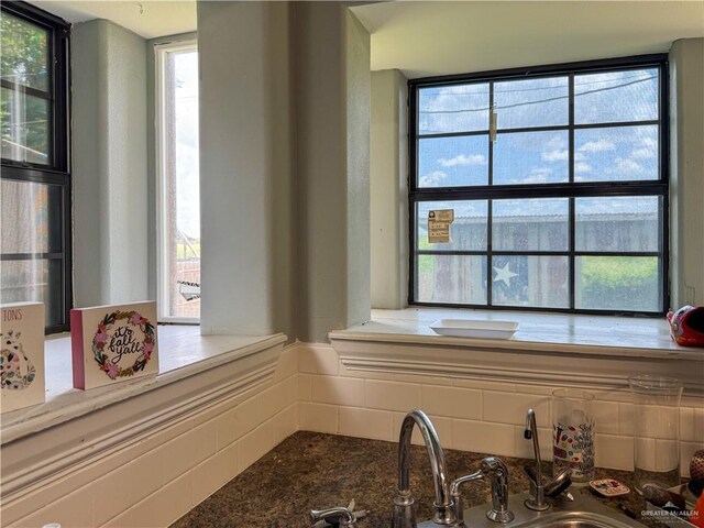 13307 Ash Ave, Edinburg, TX 78542 - kitchen featuring stone counters and decorative backsplash