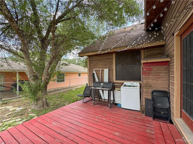 13307 Ash Ave, Edinburg, TX 78542 - deck featuring a fenced backyard, a grill, and washer / dryer