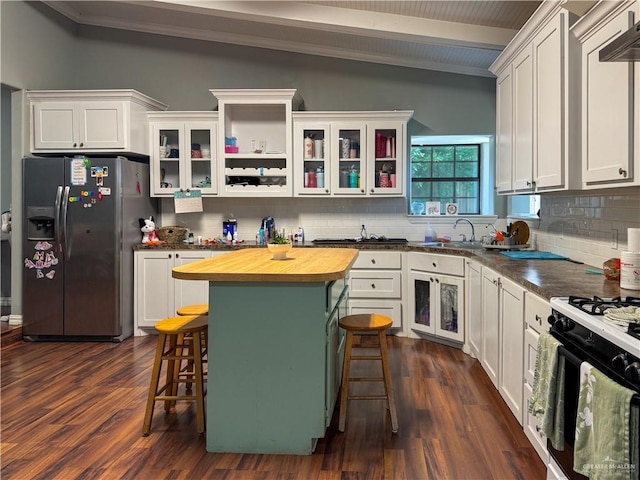 13307 Ash Ave, Edinburg, TX 78542 - kitchen with stainless steel refrigerator with ice dispenser, wood counters, a breakfast bar, backsplash, and ornamental molding