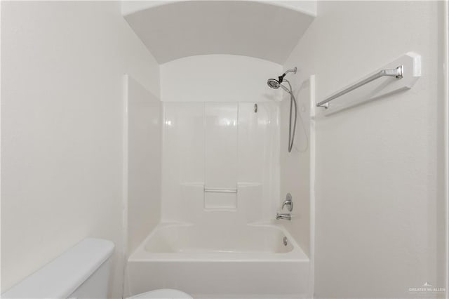 bathroom with toilet and tub / shower combination