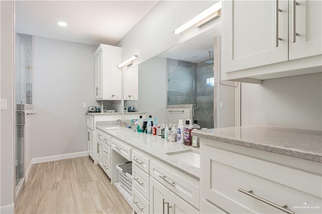 6907 N 11th Ln, Mcallen, TX 78504 - full bathroom with a shower stall, double vanity, baseboards, and recessed lighting
