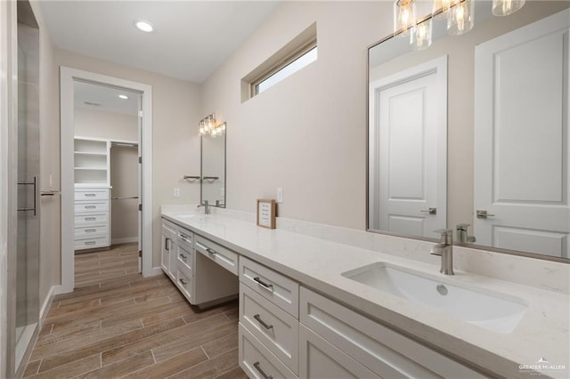 bathroom featuring hardwood / wood-style floors and vanity